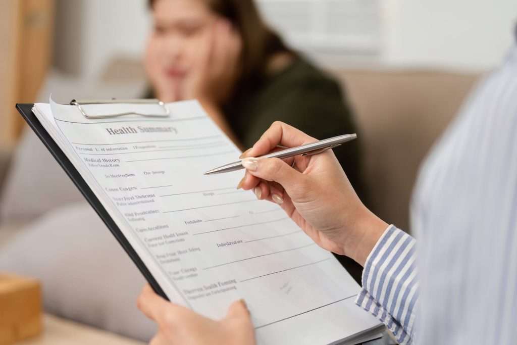 Healthcare provider consulting with patient about a personalized TruDose wellness program designed to support overall health, performance, and individualized care.
