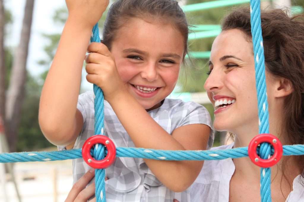 Smiling mother and daughter enjoying time together, representing family wellness, health,
              and personalized care at A Brighter Tomorrow Whole Health Center.